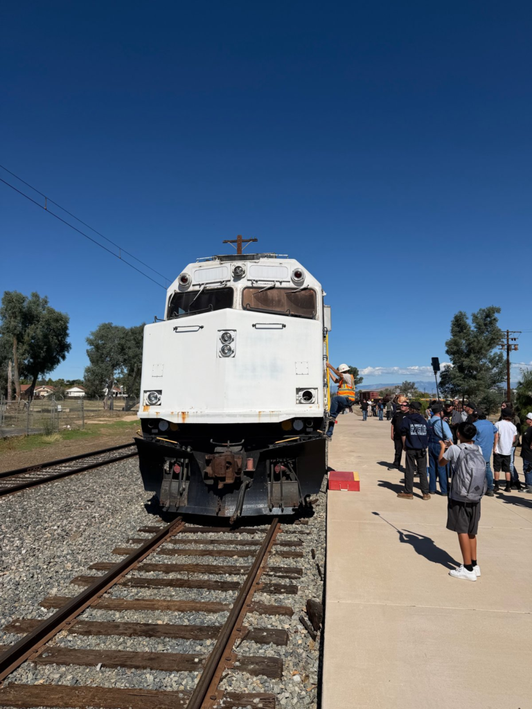 Metrolink No. 800 head-on, with visitors on the platform, October 24, 2026, at the Southern California Railway Museum
